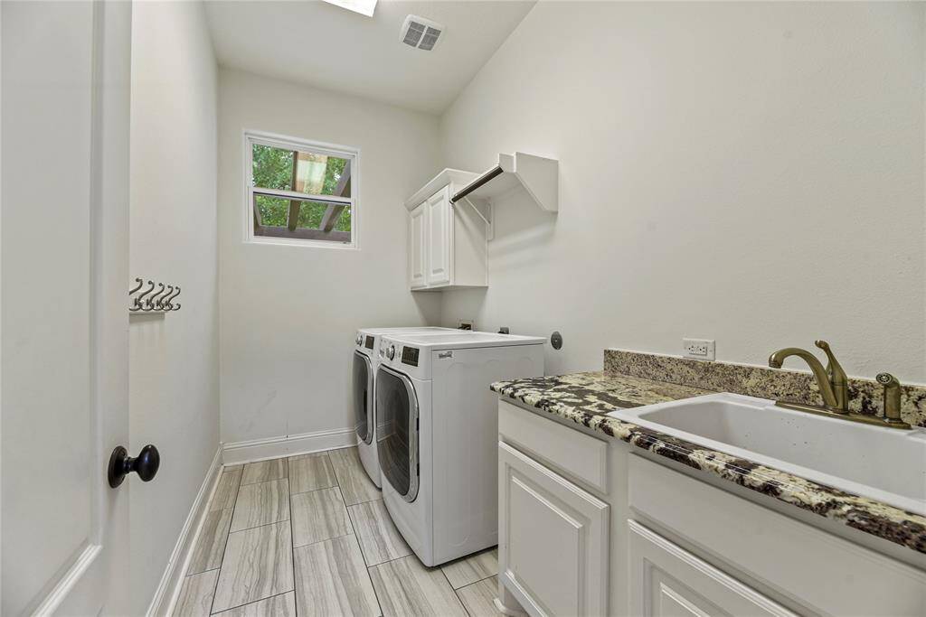 The utility room includes a sink with storage for cleanliness and tidy function. Place cleaning supplies beneath for easy and quick access.