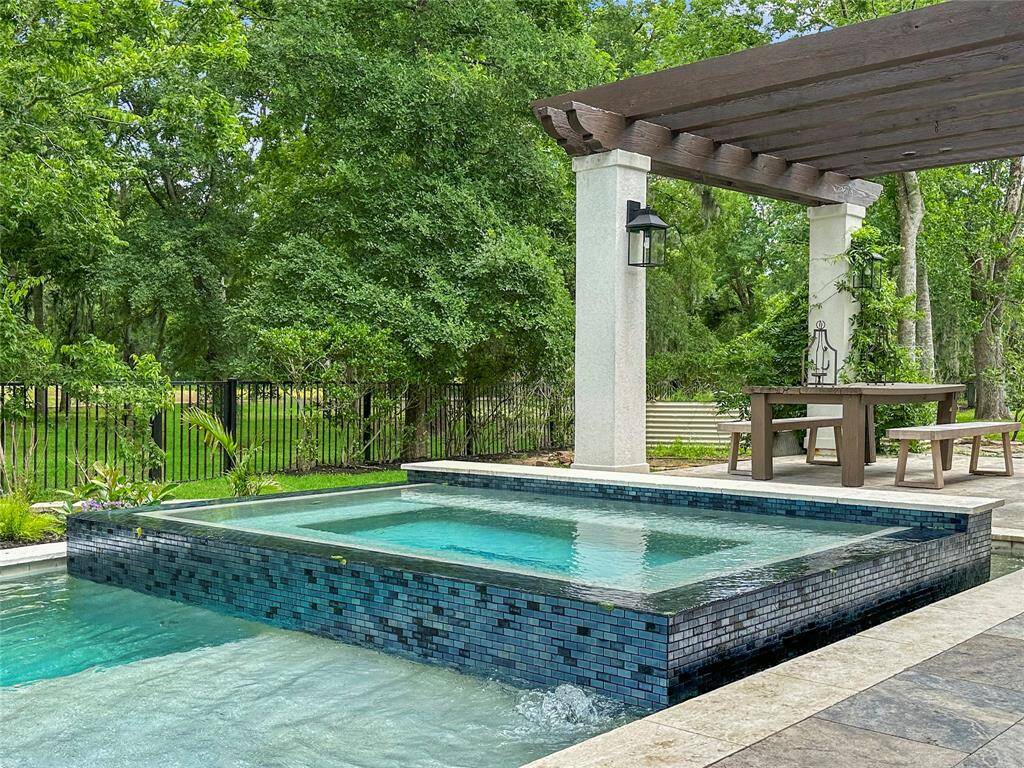 Relax in your private outdoor spa, perfectly paired with a custom-designed pool featuring brand-new tiling and modern lighting. This luxurious setup transforms your backyard into a serene, resort-style retreat day or night.