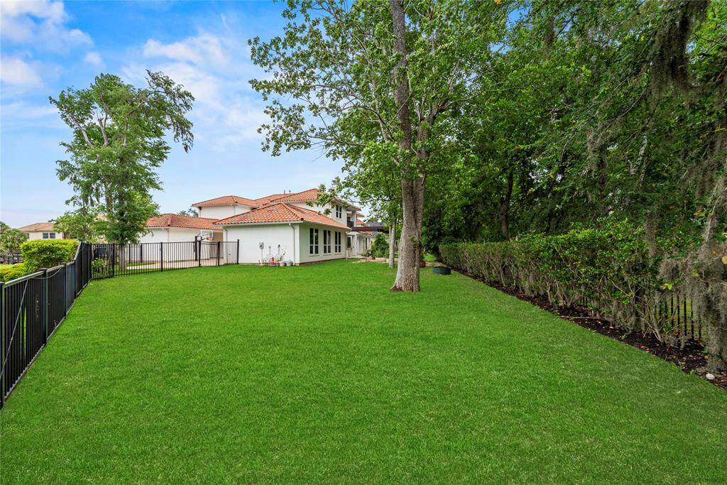 Sprawling emerald-green grass adorns this meticulously manicured lawn. Completely level, this 0.43 acre-lot offers an ideal space for gardening, playing, and gathering.