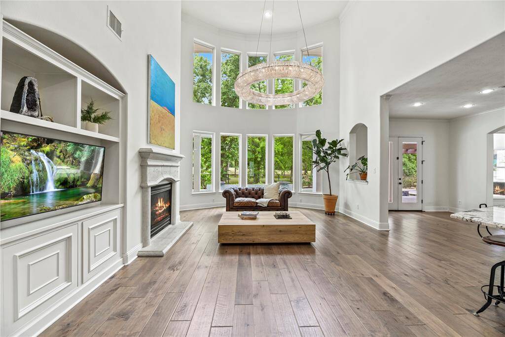 Welcoming and conveying warmth, the living room offers an inviting space for evening movies or holiday gatherings. Tune into your favorite streaming show, while admiring the cozy fireplace.