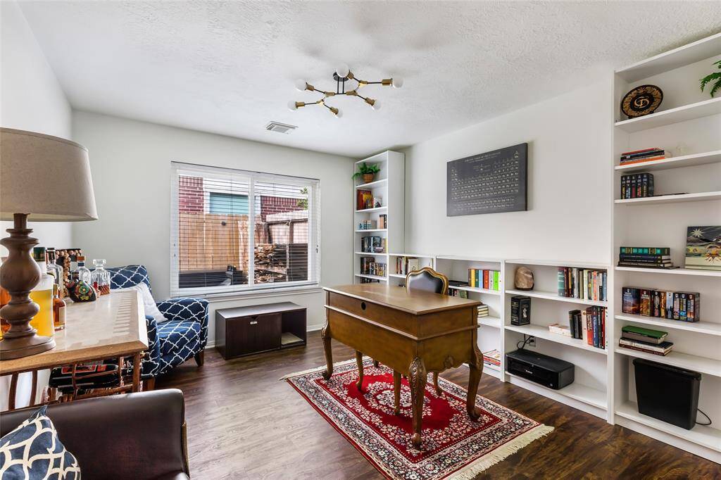 Spacious home office w/ shelving. Perfect flex space for a game room, 4th bedroom, reading library or potential sunroom.