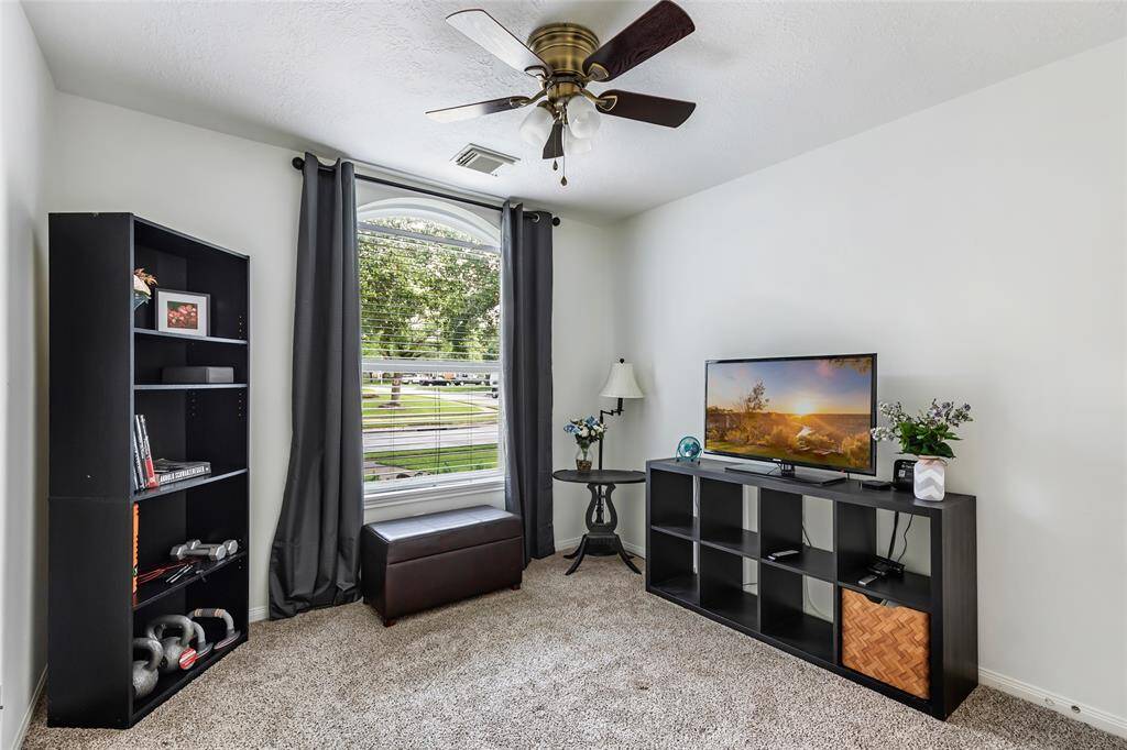 Bedroom 3 with updated ceiling fan and window