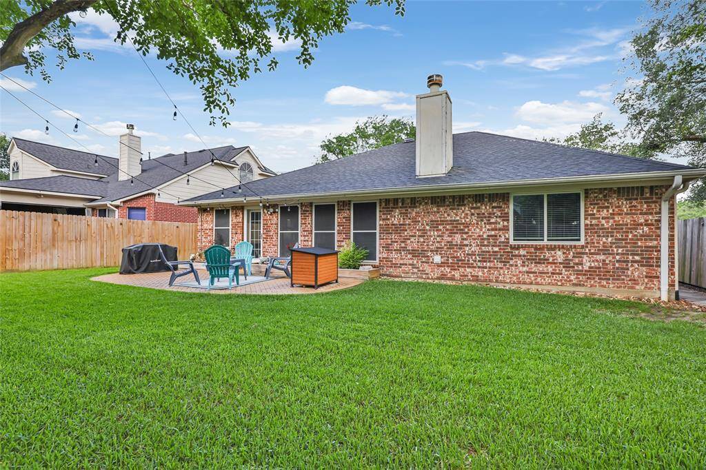 Brick on all 4 sides, gutters tied into underground drainage system, new windows, and a spacious back yard with tasteful paver patio.