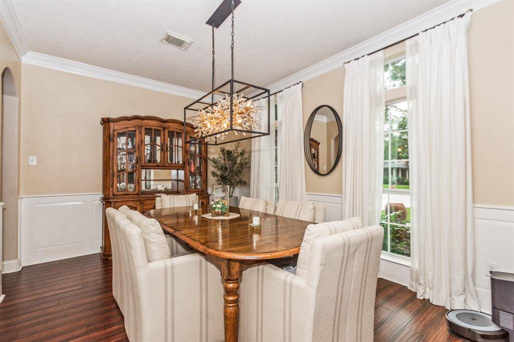 This elegant dining room accommodates a large table, perfect for memorable family gatherings