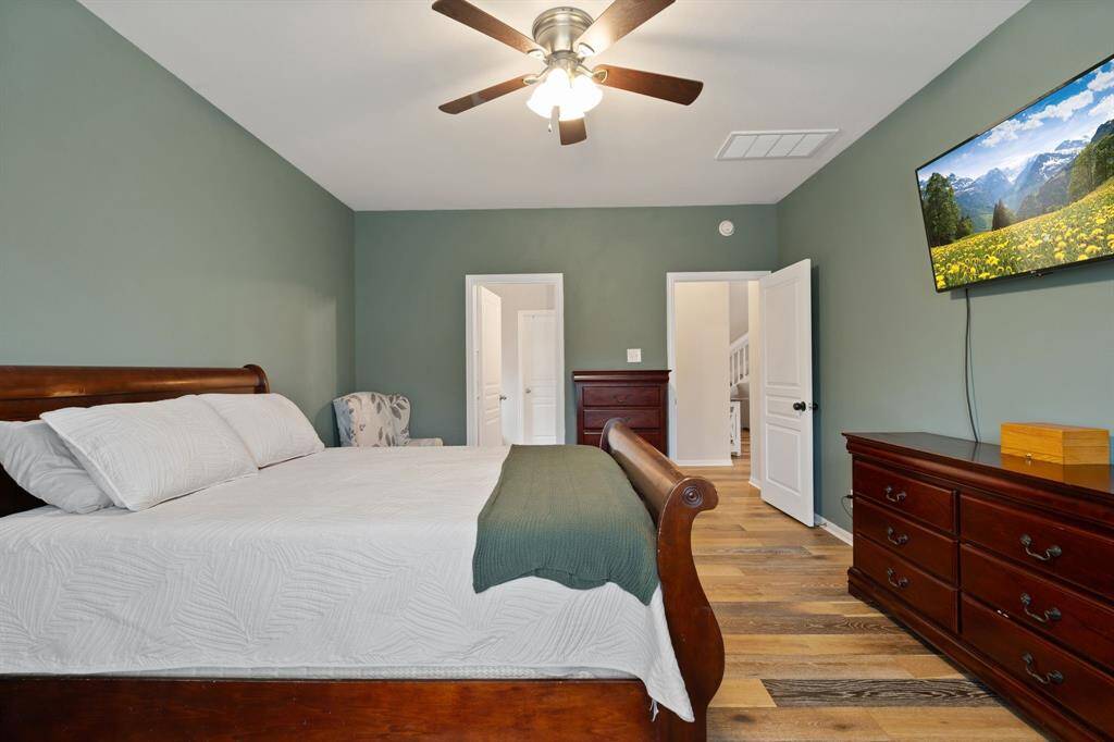 Relaxing primary suite with walk-in closet and en-suite bath