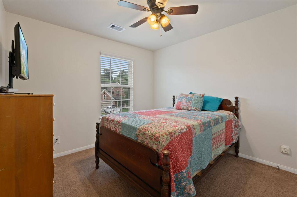 One of three bedroom upstairs with natural light.