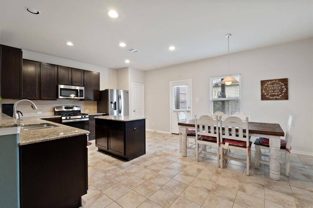 Open-concept kitchen and dining area with plenty of natural light