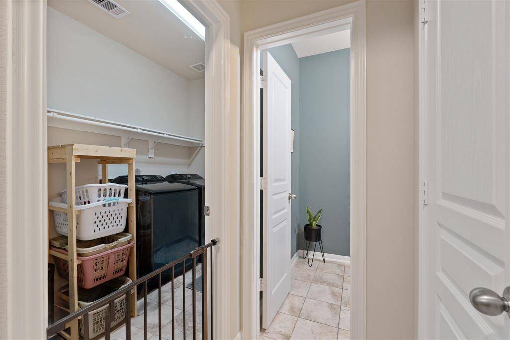 Spacious laundry area off the hall on the main floor