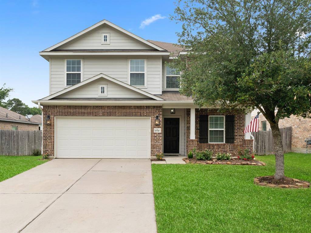 This stunning two-story brick and siding home with charming curb appeal is ready for its next chapter.