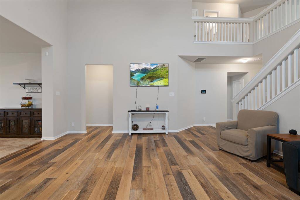 Spacious living room with soaring ceilings and natural light