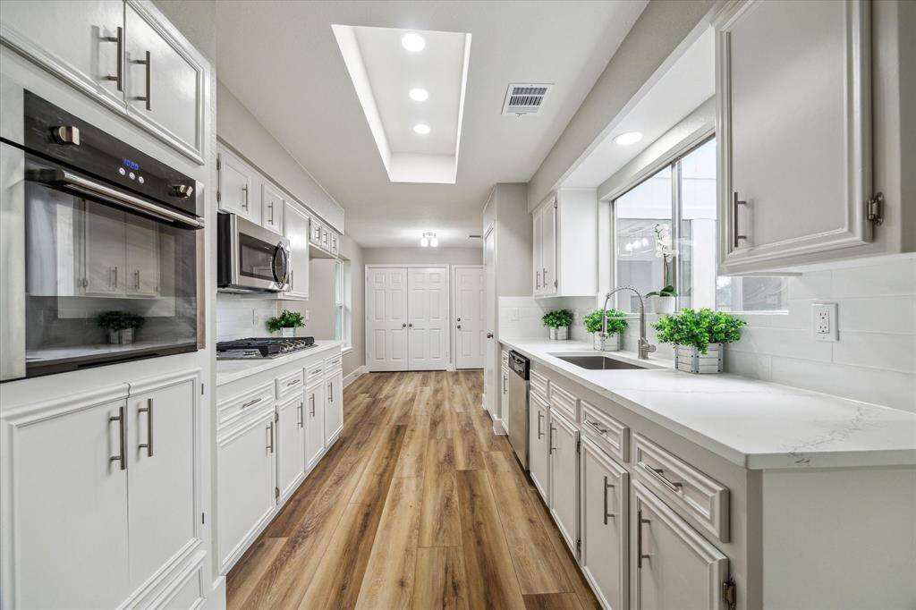Kitchen open to the living room and the atrium