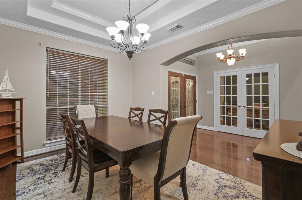 Another peek at the dining room, entrance and home office/study on the other side of the french doors