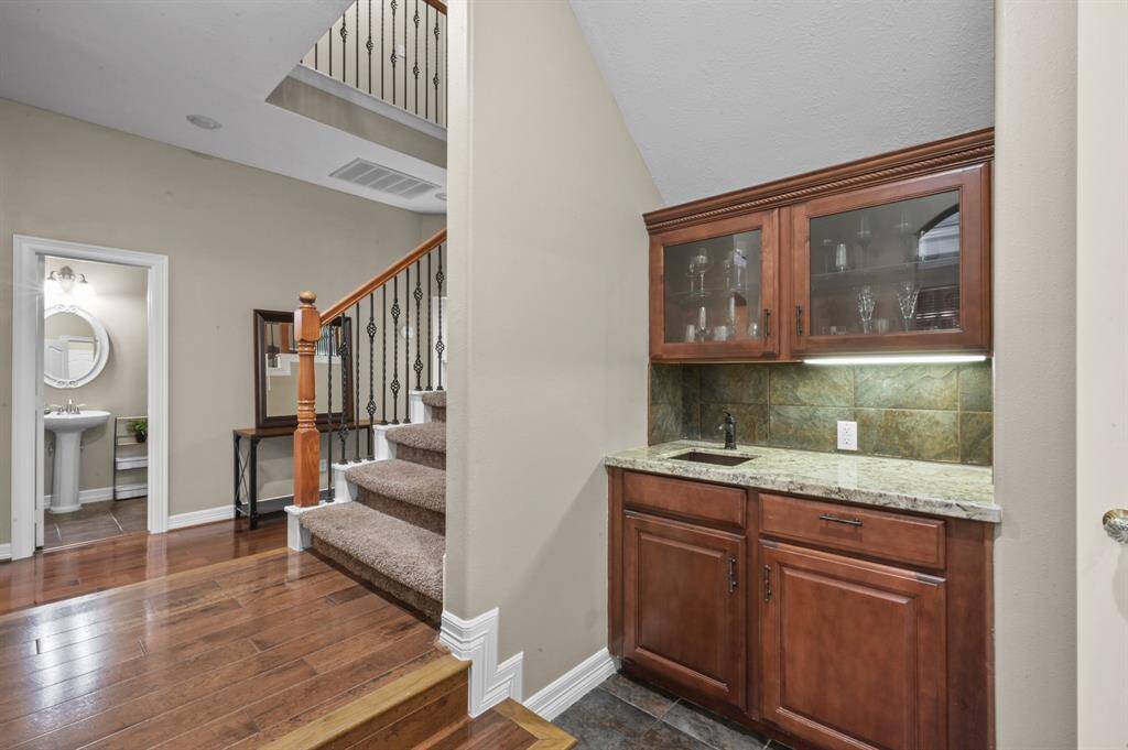 The butler's pantry is convenient to the kitchen and dining room, complete with sink!