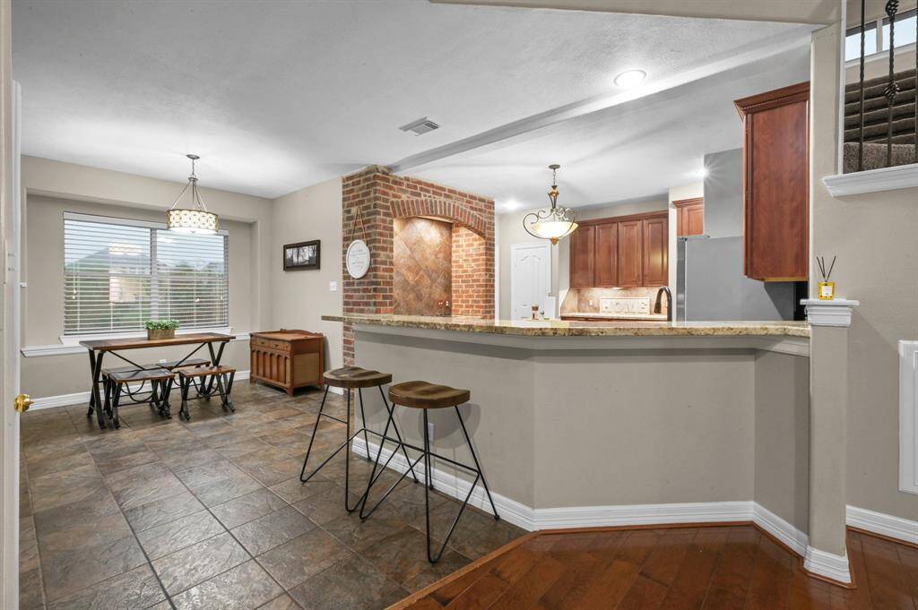 Bar height counters and breakfast room provide ample seating for all