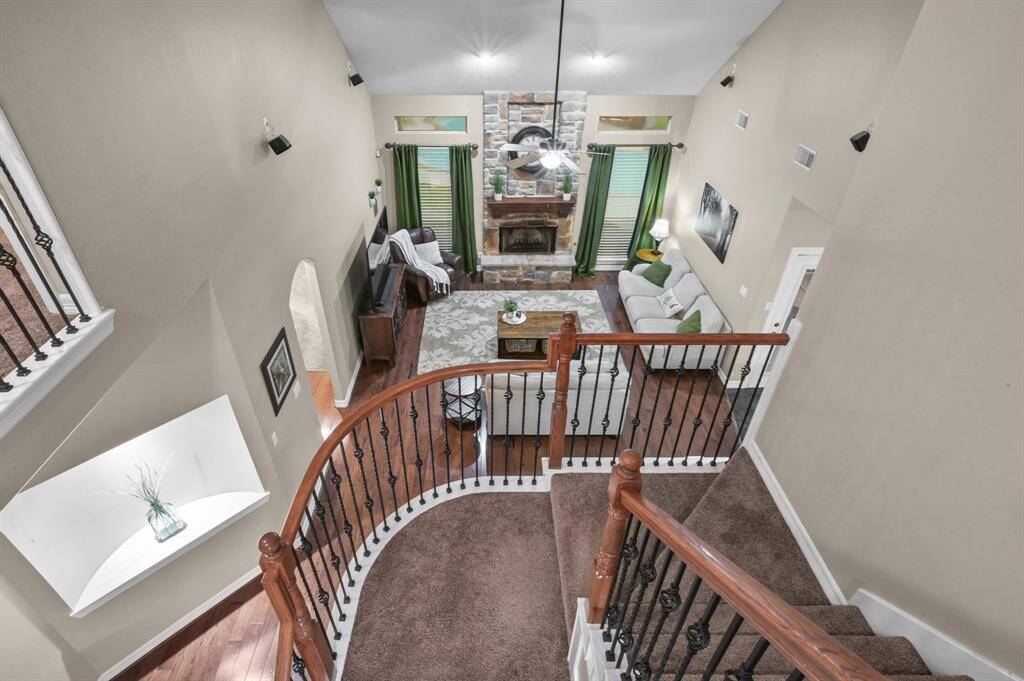 The beautiful staircase is a focal point from the living room to the upstairs
