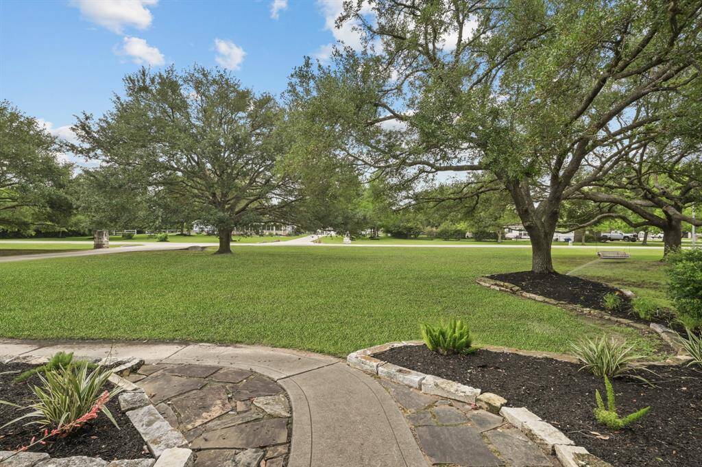 Another look at the front yard, and the lease includes yard maintenance for easy living for you