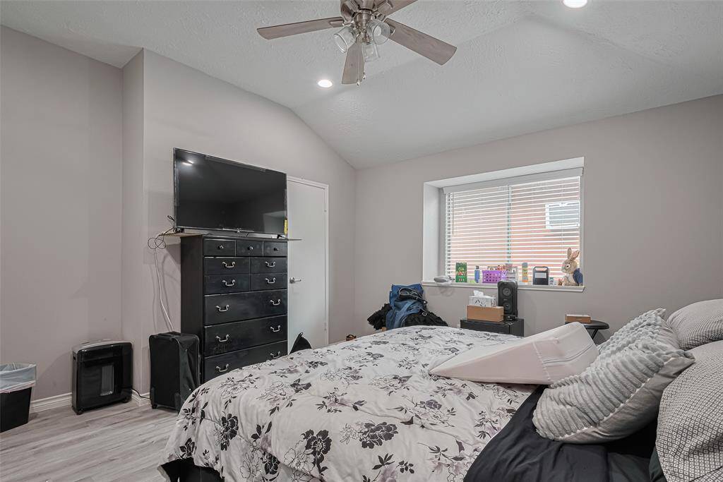 A little different view of the primary bedroom.  The door to the right of the highboy is the oversized walk-in closet