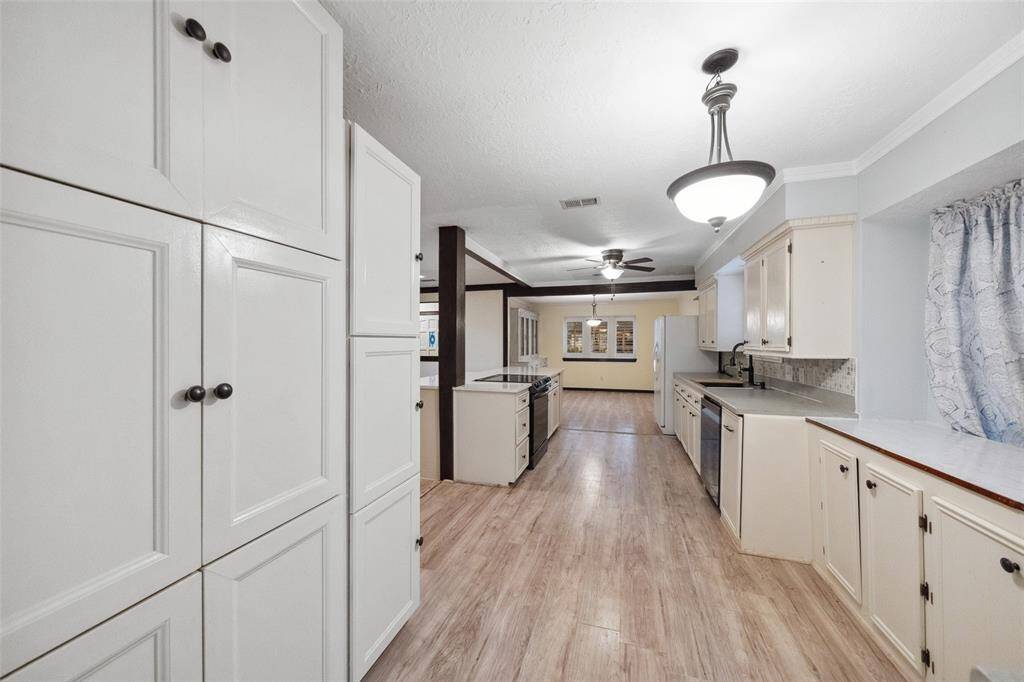 Additional cabinets for kitchen/pantry storage.