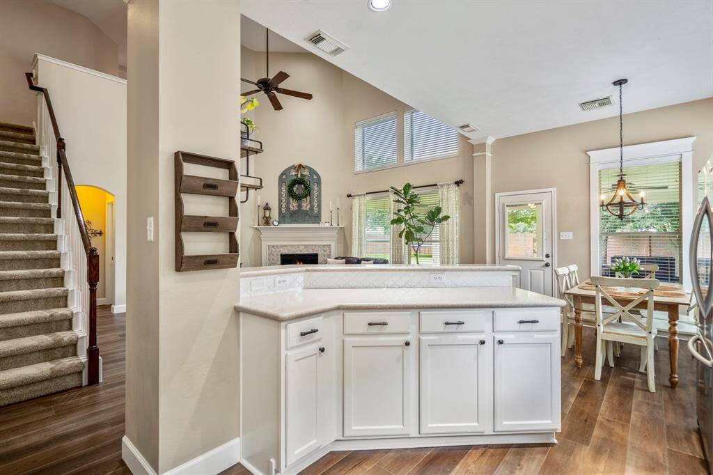 This home offers many elevated features that allow you to live in harmony, with a corner breakfast bar, plenty of cabinetry offering storage, and an abundance of countertop area to serve guests when entertaining.