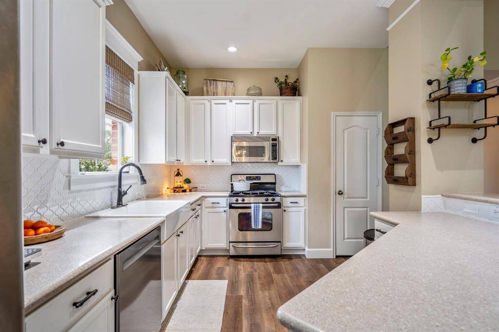The streamlined kitchen makes entertaining a crowd effortless in this traditional-meets-modern cooking space.