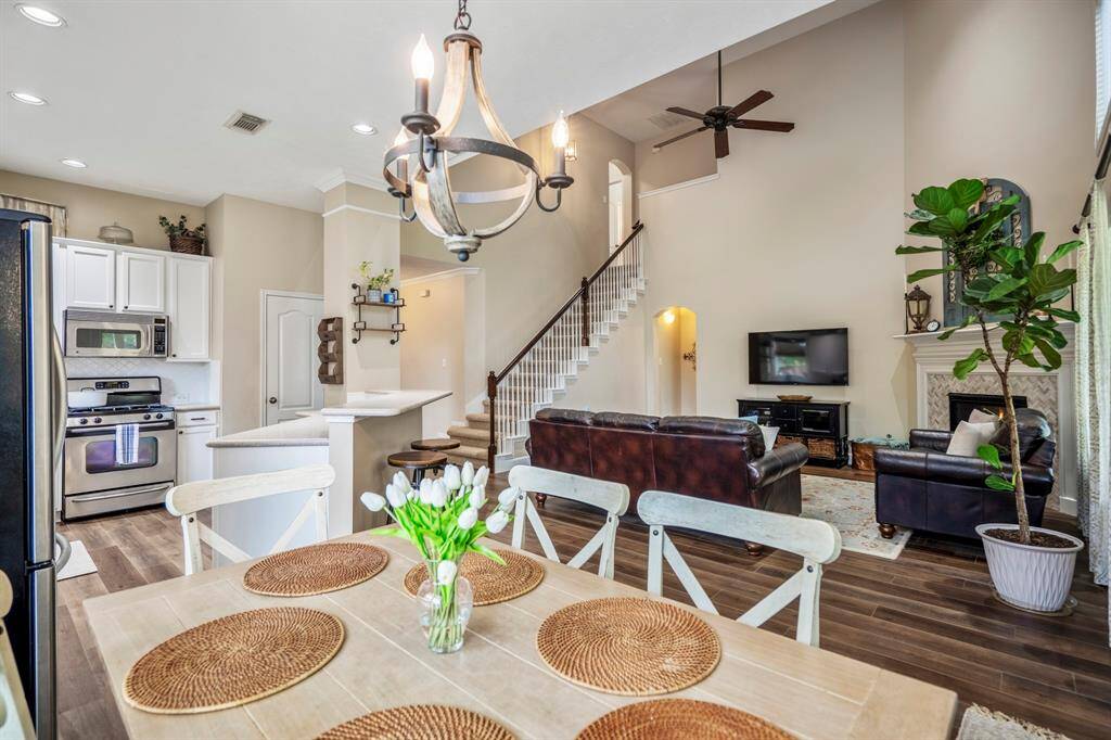 Here you have a view from the breakfast area looking towards the open floorplan of the living area and stairs leading to the second floor living.