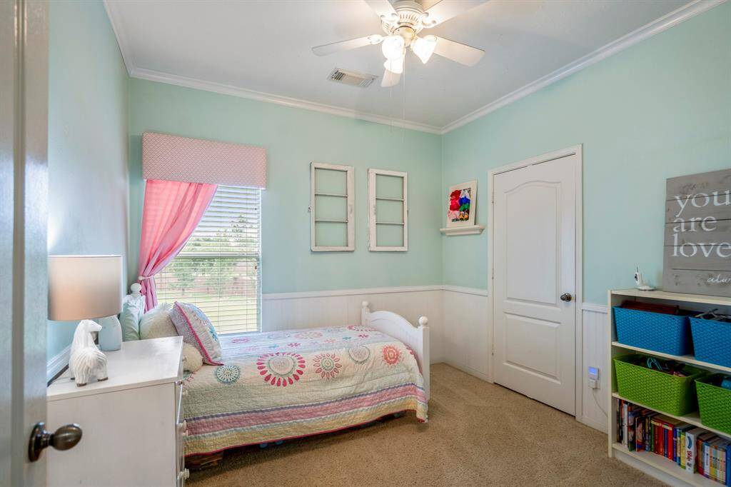 The fourth bedroom upstairs has decorator touches, a nice size closet and views of the backyard.  There are three spacious bedrooms & two full baths upstairs.