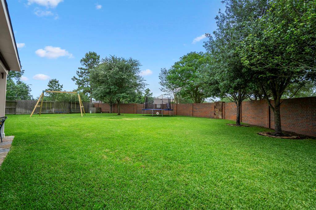 This huge backyard offers many versatile options for your family to enjoy, while being surrounded by majestic trees that area established and thriving.