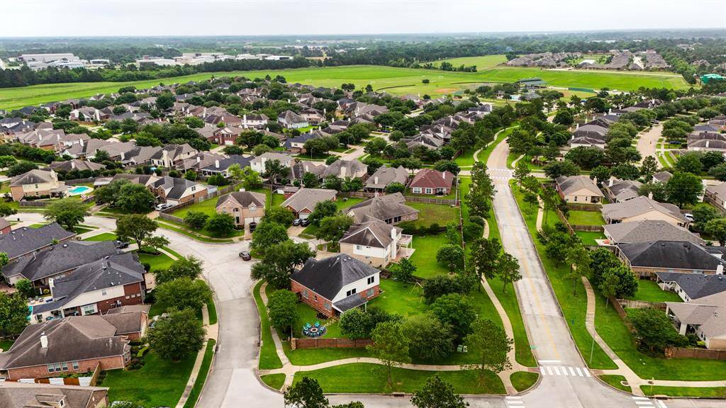 Another view of the home, surrounded by other beautiful homes and within a short walk to the Sports Complex, which offers 21-acres of options, such as baseball fields, sand volleyball, soccer/lacrosse fields, 3 pickleball courts & more!