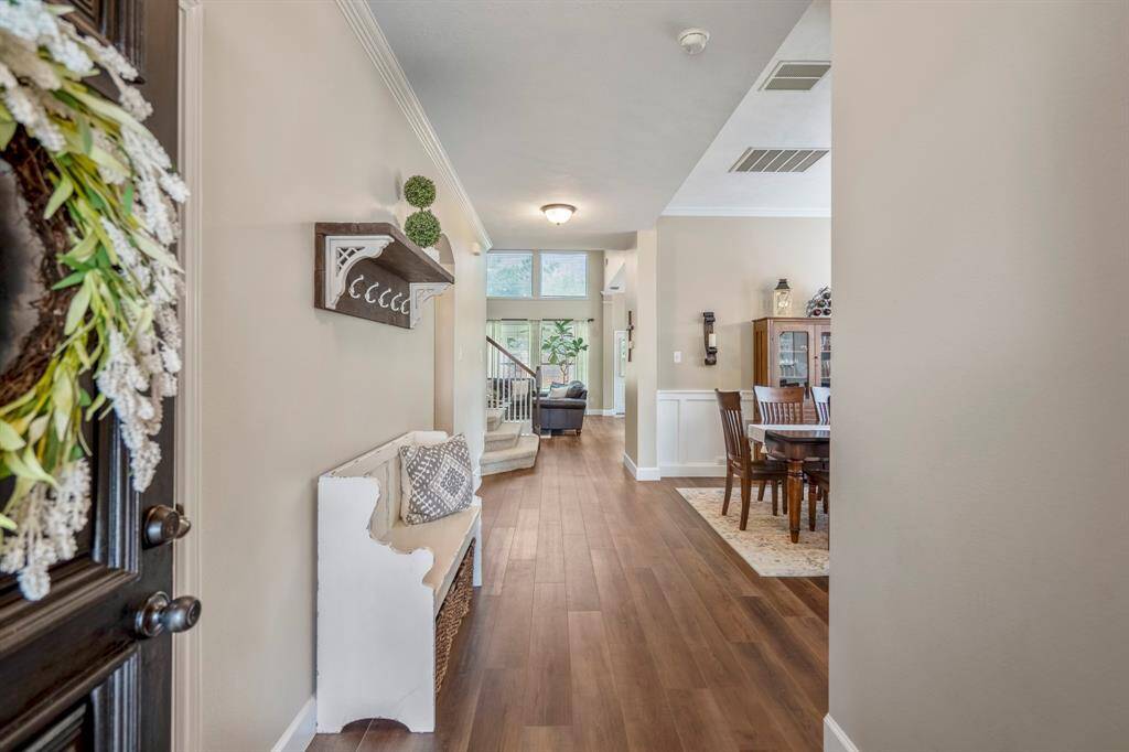 Welcoming entry features gleaming LVP wood like flooring throughout and features many wonderful decorator updates.