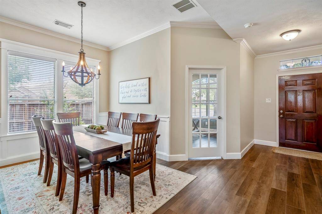Surrounding the windows you have a thick crown molding also giving a luxury elevated feel to the dining room.