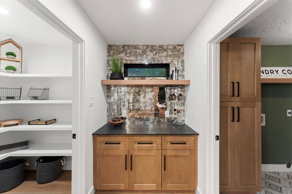 Redesigning this home added a walk-in pantry, wine bar, and walk-in laundry room.