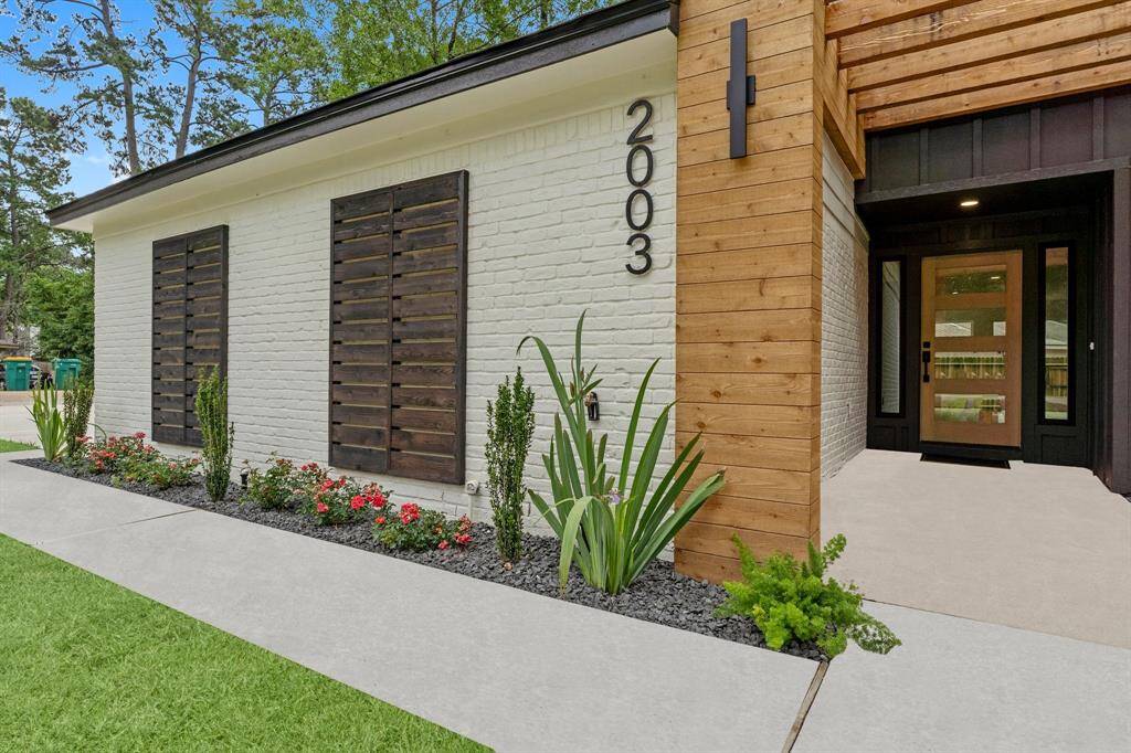 New concrete driveway and walkway to front door adds a fresh new look.