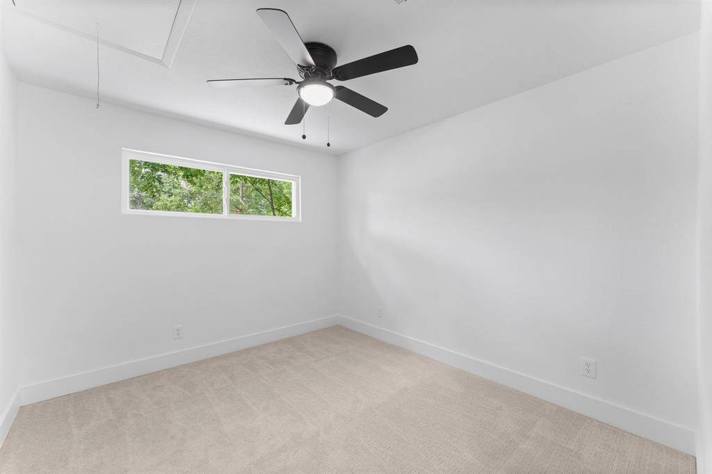 Bedroom 2 is completely brand new! New window, plush carpeting, new paint, new trim, new door and ceiling fan.