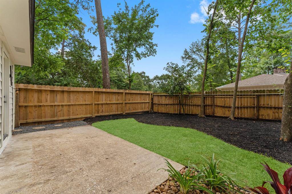Patio off living room, beautiful green lawn, fresh landscaping and new fence!