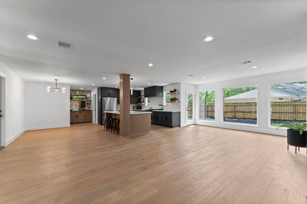 First floor has been redesigned to the highly desired open living concept. Large living room has incredible wall of large windows overlooking backyard. Authentic white french oak wood floors adds a level of warmth, texture, and chatacter.