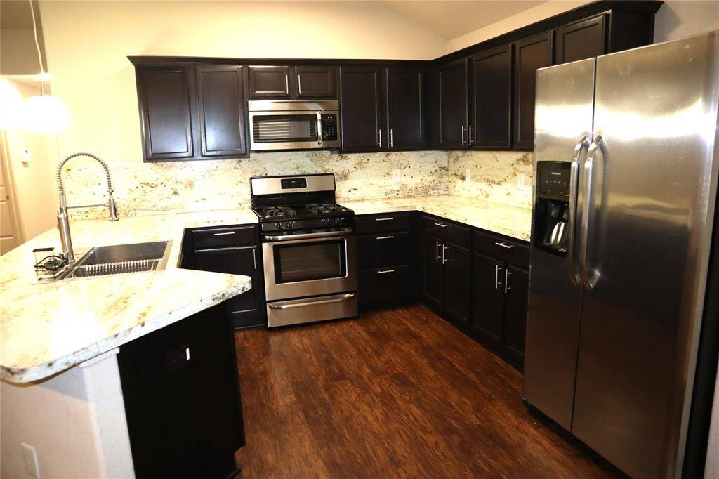 Kitchen with stainless Appliances.