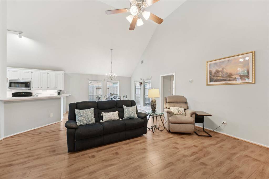 Living room is open to a dining area and kitchen.