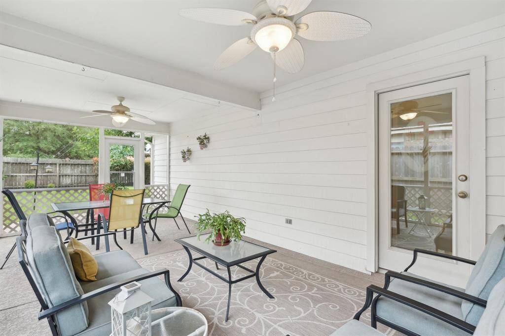 This charming screened in porch is a fabulous addition.