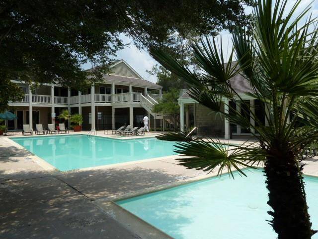 Largest of 4 Pool Areas on Property.  Club House and Gym Room are Shown in the Background