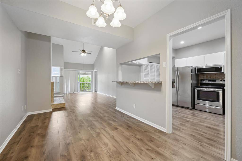 Enjoy this Open Concept of Living Area, Kitchen and Dining.