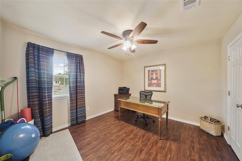 UPSTAIRS BEDROOM #2 OR-Flexible space ideal for a home office, gym with wood flooring and ceiling fan.