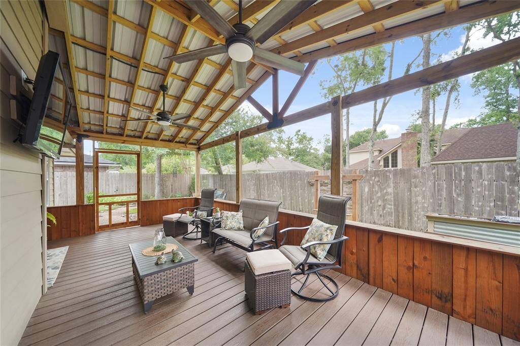 screened-in patio with TV mount, ideal for entertaining and relaxing outdoors. SO PEACEFUL AND SERENE!