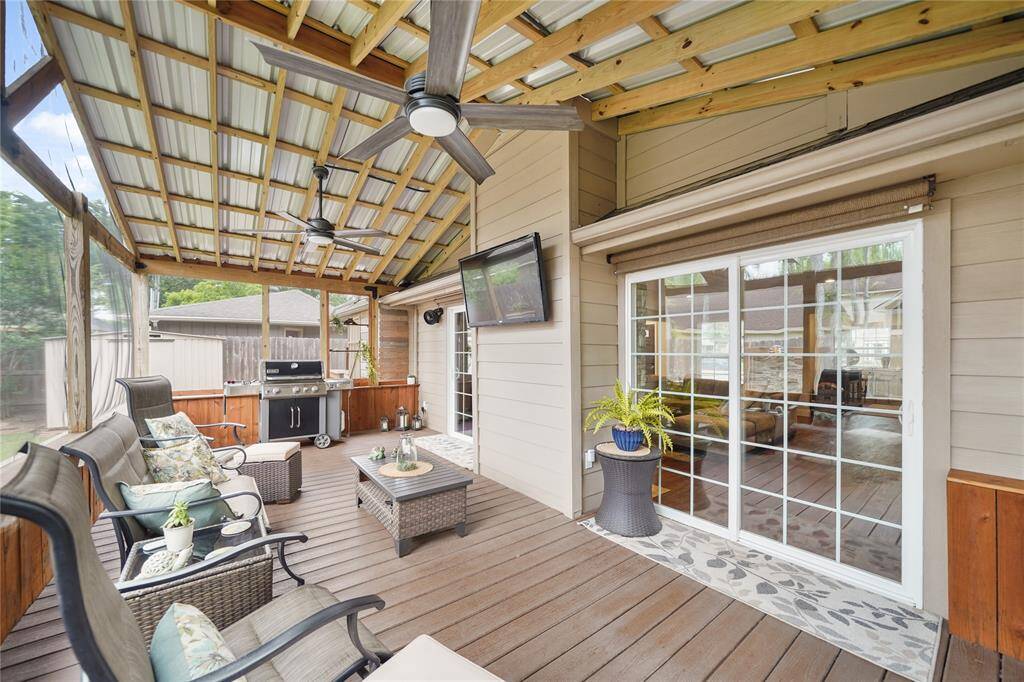Alternate angle showing seating space, ceiling detail, and WIDE WALK THROUGH DOORS INTO THE HOME!