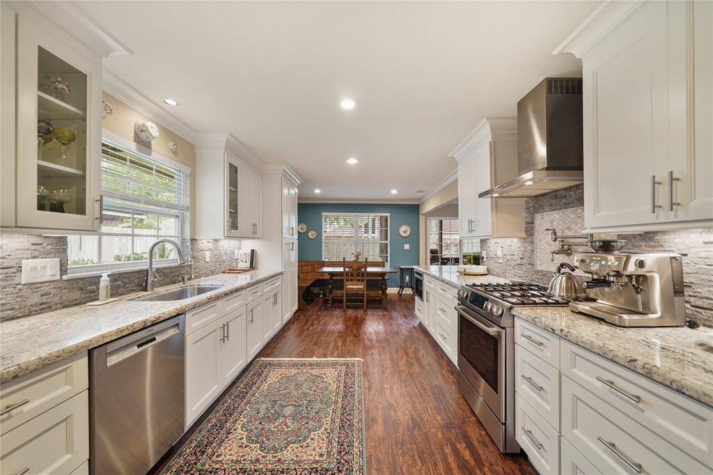 Long AND OPEN! galley-style kitchen with premium appliances, reverse osmosis system, and generous cabinet space. SOFT CLOSE CABINETS AND DRAWERS!
