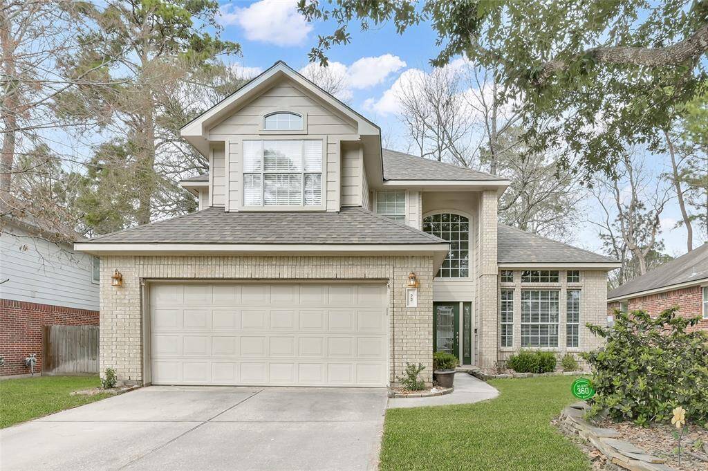 This inviting two-story home features a modern brick exterior, a two-car garage, and large windows for natural light. The well-maintained front yard adds to its curb appeal, nestled in a leafy neighborhood.