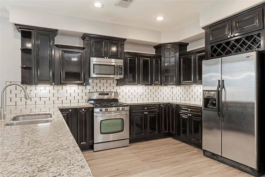Rich and elegant cabinetry really highlight the beauty of this kitchen.
