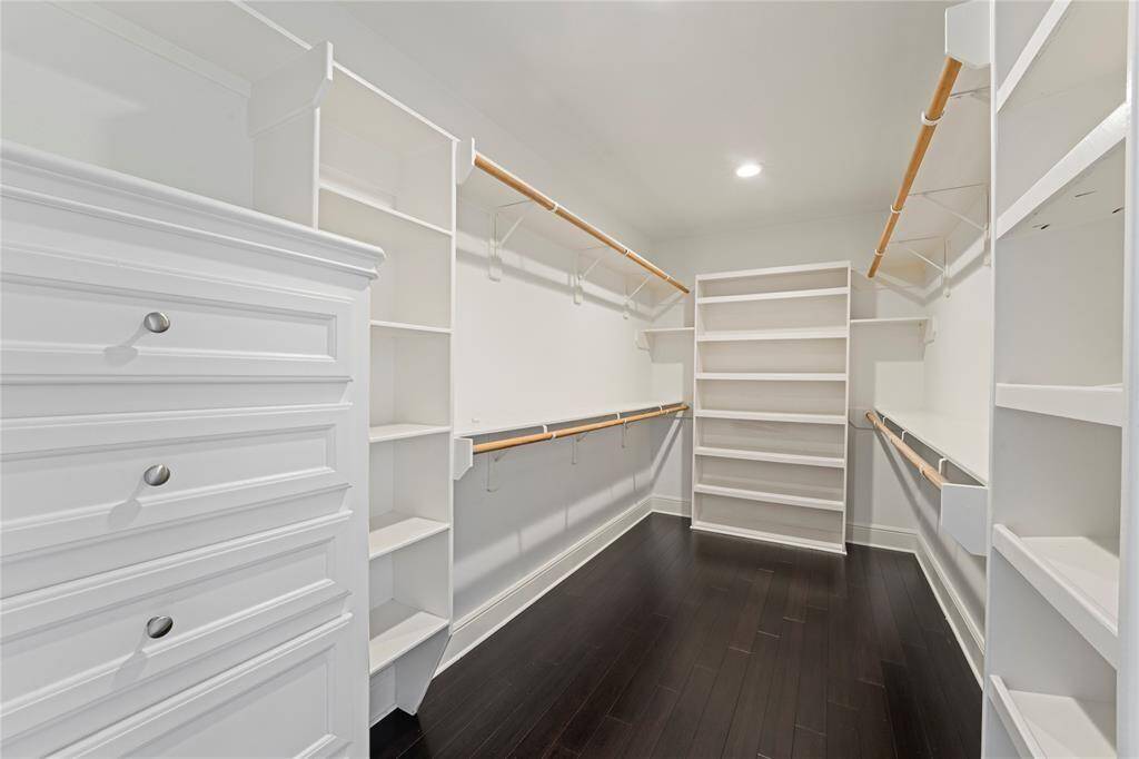 Huge walkin closet completes the primary bedroom with tons of built ins!