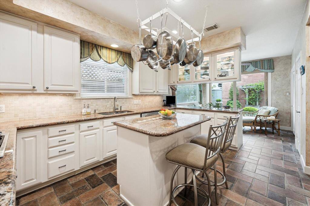 Kitchen with adjoining breakfast room.