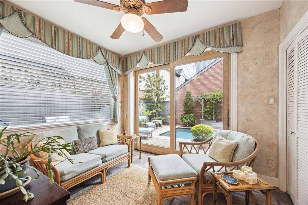 Pretty breakfast room with views of landscaped patio & terraced pool.