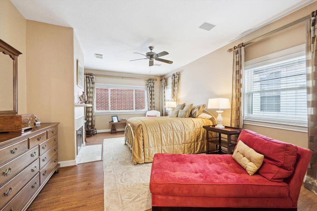 Primary bedroom with second fireplace, engineered hardwoods.